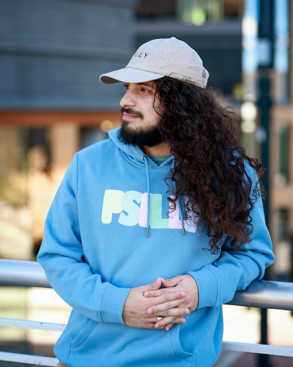 Blue PSILLY hoodie and stone dad hat